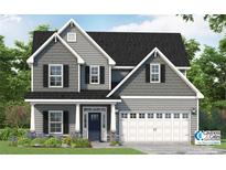 Charming two-story home showcasing a well-manicured front yard, covered entry, and an attached two-car garage at 416 Black Duck Ln, Lillington, NC 27546