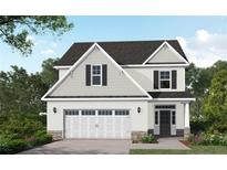 Charming two-story home with black shutters, an attached two-car garage, and a beautifully landscaped front yard at 496 Black Duck (Lot 74) Ln, Lillington, NC 27546