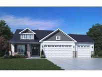 Charming two-story home with a three-car garage and manicured front yard at 221 Hillwood Dr, Sanford, NC 27332