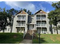 Inviting condo complex featuring multiple units with private balconies and lush landscaping at 1321 Park Glen Dr # 202, Raleigh, NC 27610
