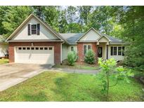 Charming single-Gathering home with a well-maintained lawn and two-car garage at 3245 Bristol St, Sanford, NC 27332