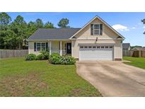 Charming single Gathering home with manicured front yard and attached two car garage at 145 Tower Dr, Broadway, NC 27505