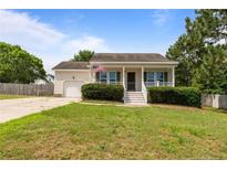 Charming single story home with a manicured lawn and inviting front porch at 182 Gunner Ct, Broadway, NC 27505