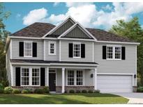 Charming two-story home featuring black shutters and a light gray facade, with a well-manicured lawn at 195 Steeple Ridge, Cameron, NC 28326