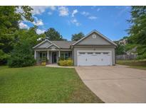 Lovely single-Gathering home with a well-kept lawn, a two-car garage, and a welcoming front porch at 138 Gold Ct, Broadway, NC 27505