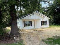 Charming single-story home with a covered porch and well-lit with plentiful windows at 707 N Wilson Ave, Dunn, NC 28334