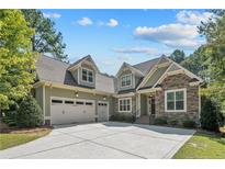Charming home featuring a spacious three-car garage and manicured lawn, perfect for curb appeal at 530 Anderson Creek Dr, Spring Lake, NC 28390