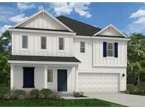 Charming two-story home with white siding, dark shutters, and a two-car garage at 510 Stadium Drive, Cameron, NC 28326