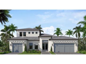 Two-story home with gray roof, white walls, and two-car garage at 1625 Hansen St, Sarasota, FL 34231