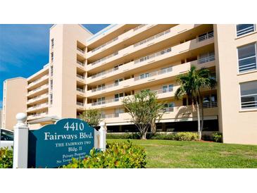 Lovely condo building with lush landscaping, blue signage, and private balconies at 4410 Fairways Blvd # 505, Bradenton, FL 34209