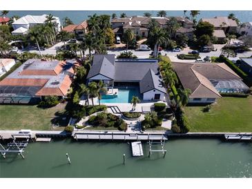 Luxury waterfront home with private pool and dock; desirable location at 414 Meadow Lark Dr, Sarasota, FL 34236