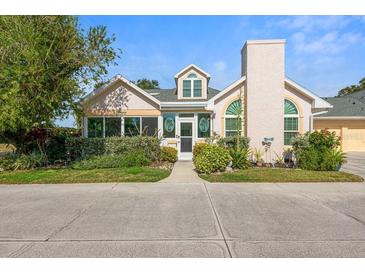 Inviting exterior of charming villa with manicured landscaping and paved driveway at 4629 Whirlaway Dr # B, Sarasota, FL 34233