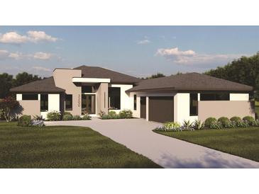 Modern single-story home with a two-car garage and landscaped lawn at 4129 Butte Trl, Lakewood Ranch, FL 34211