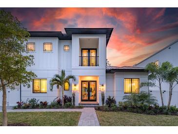 Stunning two-story home with a modern design and landscaped yard at 2440 Floyd St, Sarasota, FL 34239