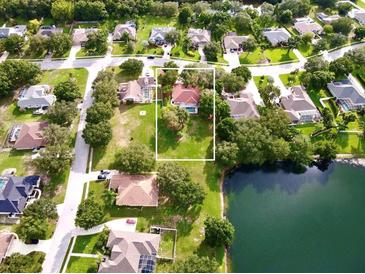 Property location shown from above, near a lake at 623 147Th E St, Bradenton, FL 34212