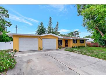 Charming ranch home with attached two-car garage and well-manicured lawn at 329 Bay Vista Ave, Osprey, FL 34229