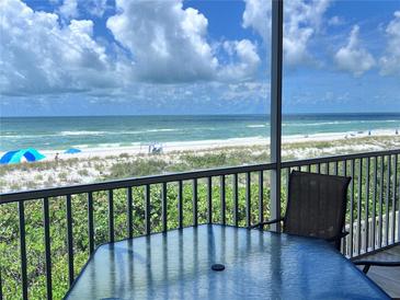 Relaxing screened balcony overlooking the beach at 1900 Gulf N Dr # 4, Bradenton Beach, FL 34217