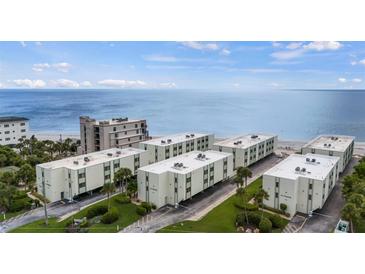 Aerial view of beachside condo community, showcasing oceanfront location and building arrangement at 2810 N Beach Rd # 106, Englewood, FL 34223