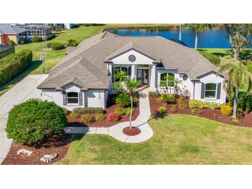 Single-story home with a large backyard, pool, and a three-car garage at 10622 Cheval Pl, Lakewood Ranch, FL 34202