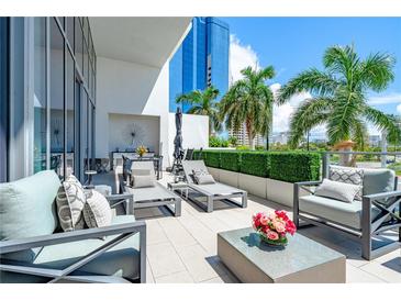 Spacious patio with comfortable seating and city views at 1155 N Gulfstream Ave # 208, Sarasota, FL 34236