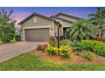 Attractive home with landscaped yard and two-car garage at 6912 Gosport Cv, Lakewood Ranch, FL 34202