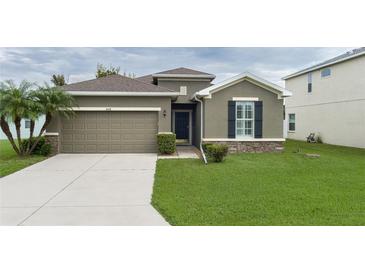 One-story house with attached garage and well-maintained lawn at 4608 Halls Mill Xing, Ellenton, FL 34222