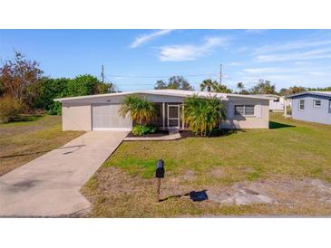 Ranch-style home with carport and fenced yard at 258 Seminole Nw Blvd, Port Charlotte, FL 33952
