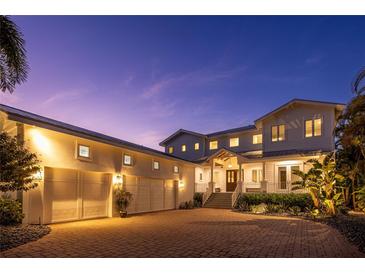 Stunning waterfront home with a three-car garage at 1243 Starboard Ln, Sarasota, FL 34242