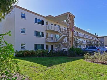 Two-story condo building with ample parking and landscaping at 4480 Ironwood Cir # 202A, Bradenton, FL 34209