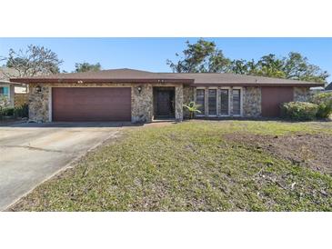 Single-story house with stone facade and attached garage at 117 Hillcrest Dr, Bradenton, FL 34209