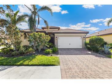 Beautiful one-story home with a two-car garage and landscaped yard at 655 Resolute St, Nokomis, FL 34275