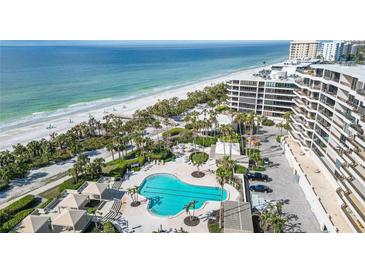 Aerial view of resort-style pool and beach access at 535 Sanctuary Dr # A202, Longboat Key, FL 34228