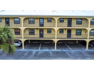 Two-story building with parking and balconies at 14459 River Beach Dr # 112, Port Charlotte, FL 33953