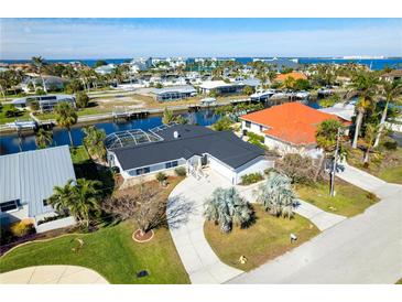 Waterfront home situated on a canal with circular driveway at 1732 Boca Raton Ct, Punta Gorda, FL 33950