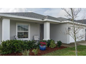 Inviting front porch with seating and landscaping at 16415 62Nd E Gln, Parrish, FL 34219