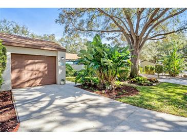 Attached garage with ample storage shelving and workbench at 2915 Oak Ln, Bradenton, FL 34209