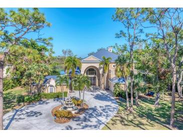 Luxury home with circular driveway and fountain at 6779 Ashley Ct, Sarasota, FL 34241