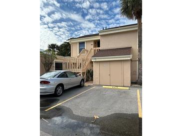 Tan condo building with stairs and parking at 6312 7Th W Ave # 6312, Bradenton, FL 34209