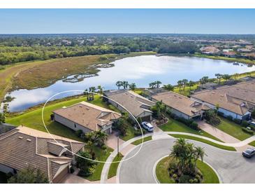 Aerial view of a single-Gathering home in a waterfront community at 5987 Snowy Egret Dr, Sarasota, FL 34238