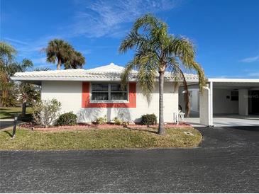 White single story home with carport and palm trees at 1741 Caribbean Cir # 13, Venice, FL 34293