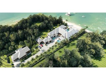 Luxury waterfront home with pool and guest house, offering stunning ocean views at 3990 Higel Ave, Sarasota, FL 34242