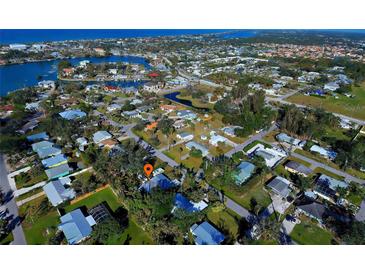 Aerial view showing home location in a residential neighborhood near the water at 315 Palmetto W Rd, Nokomis, FL 34275