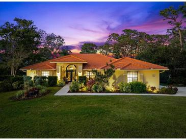 Beautiful one-story home with tile roof and landscaped yard at 3901 Balsam Ct, Sarasota, FL 34243