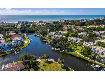 Aerial view of waterfront community with lush landscaping and private boat docks at 1912 Harbourside Dr # 603, Longboat Key, FL 34228