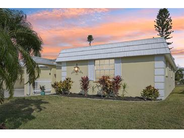 Well-maintained Ranch style home with landscaped yard and sunset view at 5891 Tidewood Ave # 1, Sarasota, FL 34231