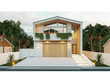 Modern two-story home with a large garage and landscaped front yard at 2321 Hillview St, Sarasota, FL 34239