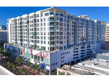 Modern high-rise building with city views and unique mural at 111 S Pineapple Ave # 1102, Sarasota, FL 34236