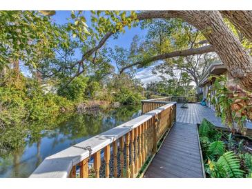 Charming waterfront deck overlooks peaceful canal; perfect for relaxing at 2961 Homasassa Rd, Sarasota, FL 34239