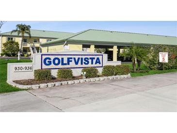 Golfvista community entrance sign with landscaping and paved road at 932 Capri Isles Blvd # 216, Venice, FL 34292