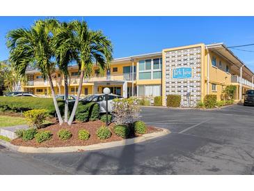 Attractive condo building with palm trees and ample parking at 2155 Wood St # B17, Sarasota, FL 34237